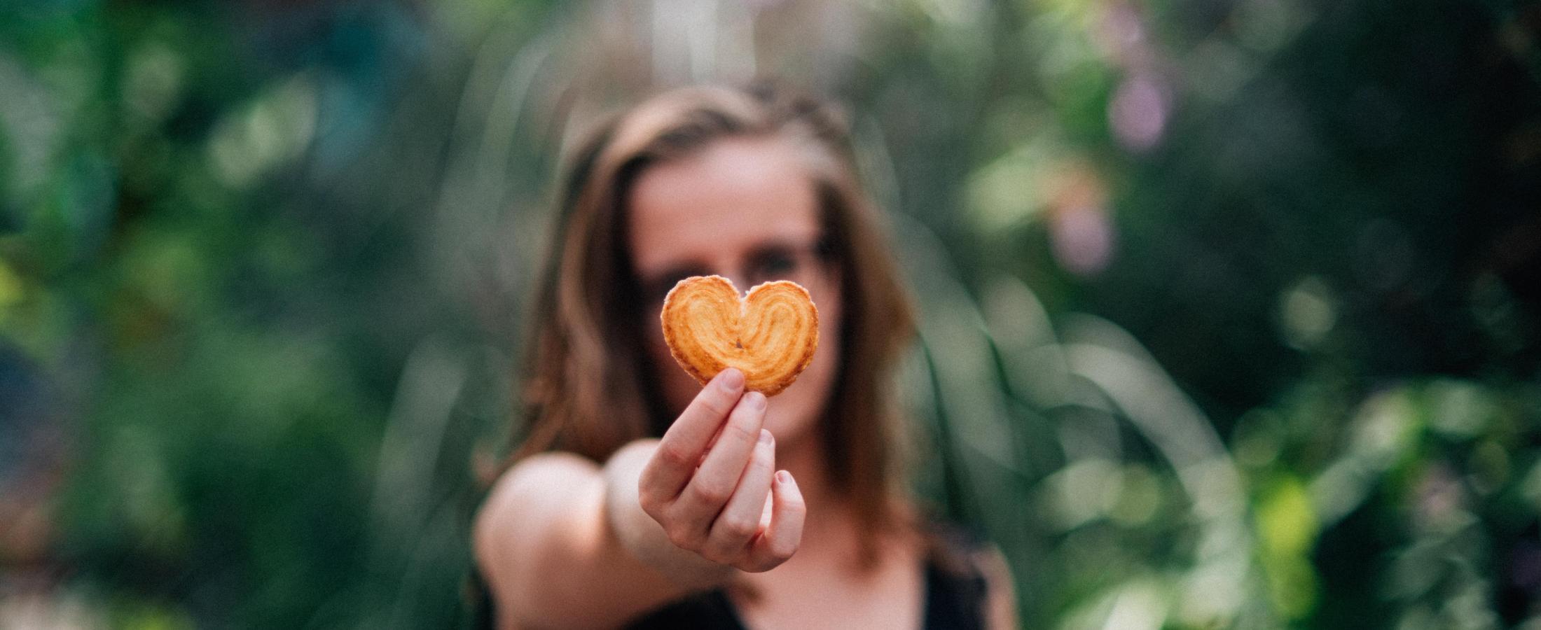 young woman with cookie heart