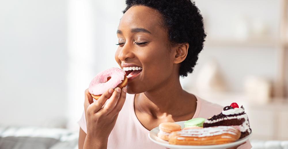 woman eating pastry